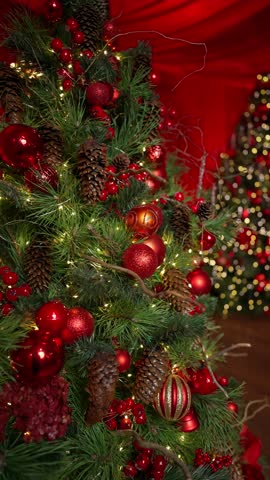 Close-up of a festive Christmas tree with red decorations. New Year