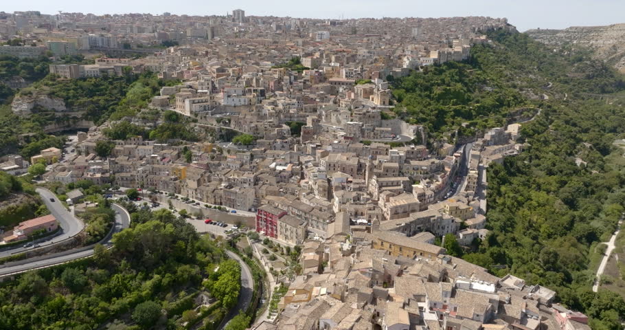 Aerial view of houses, roofs, and buildings in a typical historic center of a small Italian village. They are located in Ragusa Ibla, Sicily, Italy.