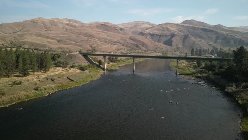 Aerial of bridge on US 95 in White Bird Idaho over Salmon River on sunny day
