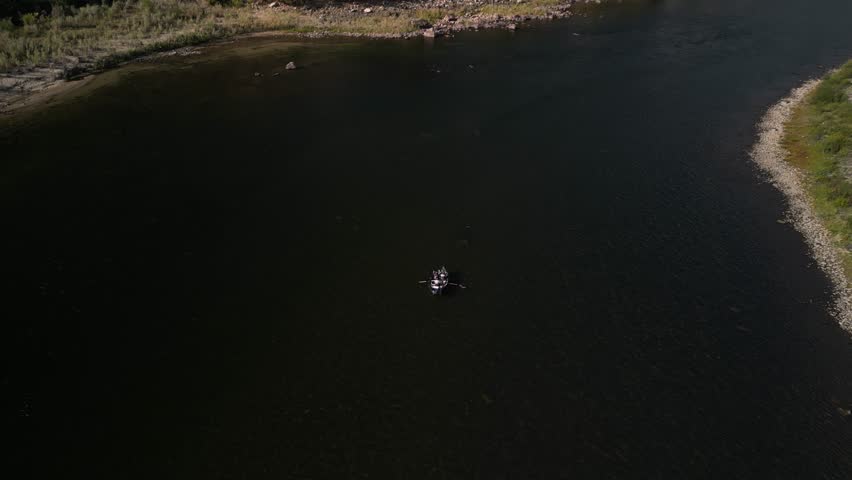 Aerial tilt down on drift boat in Salmon River in White Bird Idaho