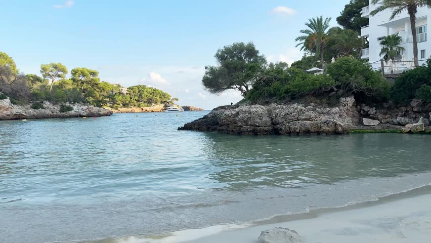 Cala Ferrera bay on Mallorca island panoramic view. Evening on the empty beach in Spain.