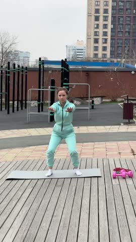 Young woman doing fitness outdoors. 