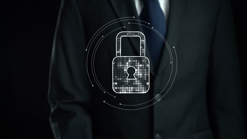A businessman in a suit stands before a futuristic display featuring a padlock and data protection symbols, illustrating the importance of cybersecurity and data security. Qubit - Powered by Shutterstock - Get 15% off with code: PIKWIZARD15