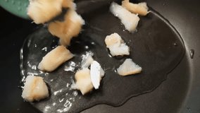 Small pieces of fish fillet from a green shoulder blade are laid out on a hot frying pan with oil. The beginning of roasting, close-up.
 - Powered by Shutterstock - Get 15% off with code: PIKWIZARD15
