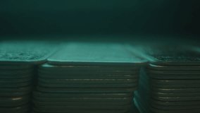 Extreme close focus rack of stacks of silver bars in a vault with blue light - Powered by Shutterstock - Get 15% off with code: PIKWIZARD15