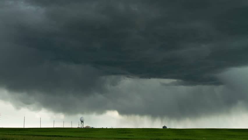 Massive thunderstorm moves over eastern Colorado, with churning storm clouds and
