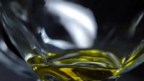 Golden sunflower oil pours into a transparent jar in slow motion, captured against a dark background. Organic cooking ingredient concept with rich texture and clarity. - Powered by Shutterstock - Get 15% off with code: PIKWIZARD15