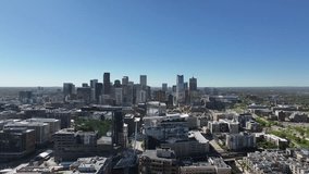 Aerial view of downtown Denver as the drone slowly descends vertically under a clear blue sky. - Powered by Shutterstock - Get 15% off with code: PIKWIZARD15