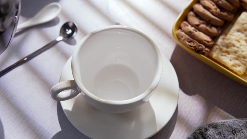 Fresh Brewed Hot Coffee Is Carefully Poured Into Cup. Filling Morning with Warm Aroma Comfort and Sense Of Peace. Simple Daily Ritual with Black Coffee that Highlights Flavor, Warmth And Relaxation 4k