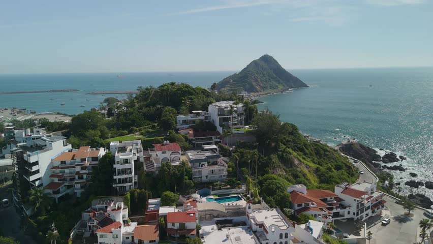 Beach Resort Hotel on Cliff Montain in Mazatlan Mexico Island with Rocks and Waves