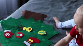Father and his son decorating toy Christmas tree together. Educational games for children. 4K - Powered by Shutterstock - Get 15% off with code: PIKWIZARD15