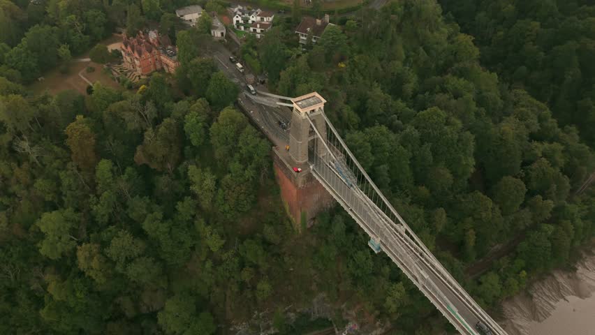 Bristol UK: 28th July 2025: Drone view of Clifton Suspension Bridge under restoration with scaffolding over the River Avon (Avon Gorge). Top-down panning shot