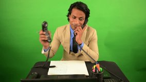 Businessman Works Effortlessly with Two Landlines Phones, Corporate Executive Multitasks On Both Calls, Smilingly Staff Handles Double Receivers in Confidence, Suited Employee Talks Confidently, Pen - Powered by Shutterstock - Get 15% off with code: PIKWIZARD15