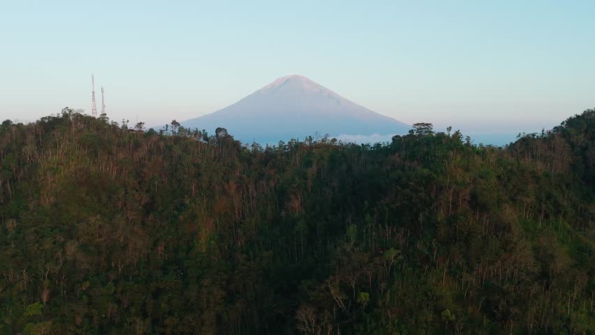 Aerial View Of Mountain Summit And Mount Agung Volcano In Background, Bali Landscape