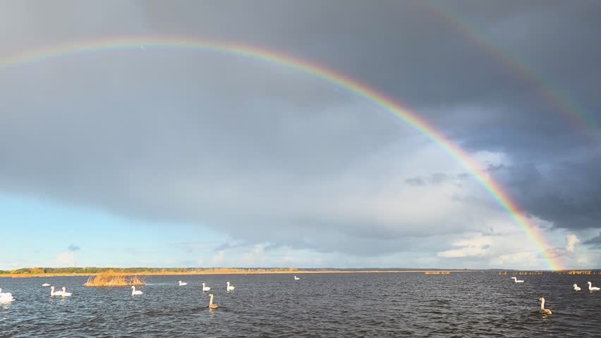 beautiful rainbow in the sky over the lake
