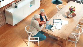 Above, senior couple and documents at house for finance, debt review and payment delay. Elderly people, argument or laptop with paperwork, financial crisis and dispute for bankruptcy of overdue bills - Powered by Shutterstock - Get 15% off with code: PIKWIZARD15