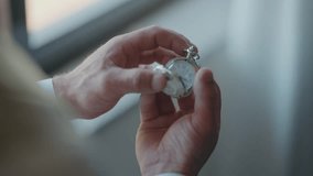 hands holding antique pocket watch in calm natural light - Powered by Shutterstock - Get 15% off with code: PIKWIZARD15