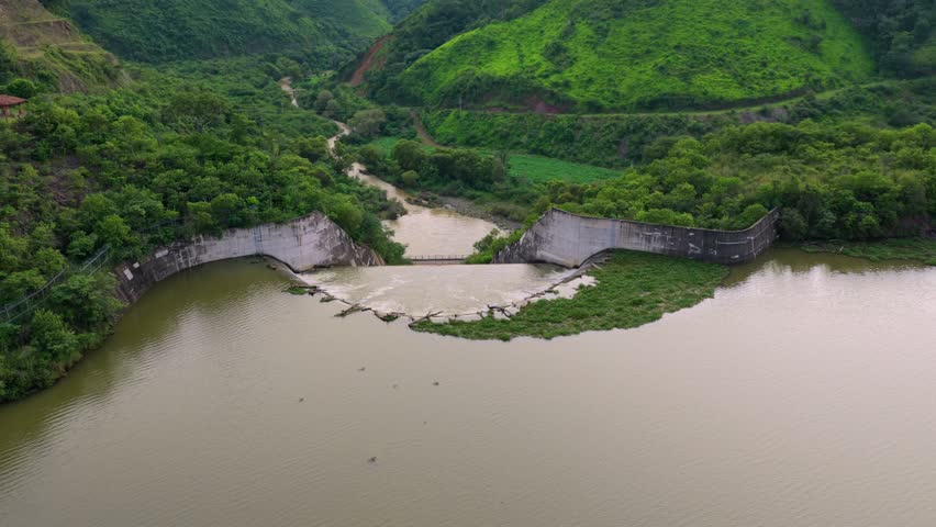 Concrete Spillway With Foamy Rushing Water At Presa EL Carrizo In Tamazula de Gordiano, Jalisco, Mexico. Aerial Drone Shot