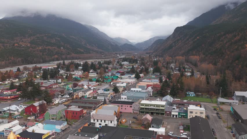 Wide aerial shot flying over historic downtown Skagway, Alaska in the fall. 4K