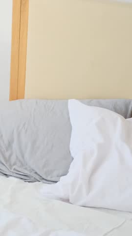 Relaxed Young African American Woman Reading Book in Bed
