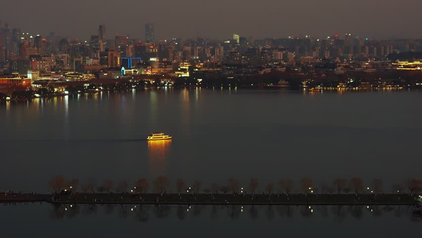 Wide Night Panorama of Hangzhou West Lake and Illuminated City Skyline