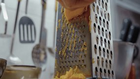 Close-up, elderly woman's hand grating pumpkin on pie grater - Powered by Shutterstock - Get 15% off with code: PIKWIZARD15