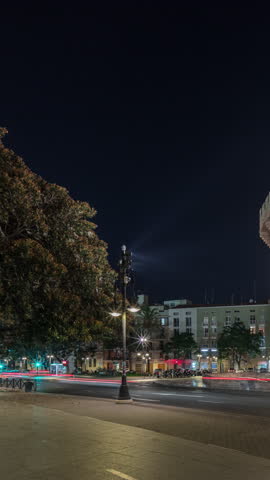Panorama showing Serrans Towers (Torres de Serranos) night timelapse in Valencia, Spain. A grand medieval gate from the city