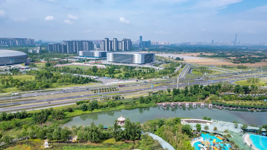 A modern sports stadium beside a wide road, urban scenery of Chengdu Sichuan China, modern cityscape timelapse