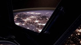 ISS Window View of Glowing Earth City Lights During Night Orbit, Elements of this Video Furnished by NASA - 4K - Powered by Shutterstock - Get 15% off with code: PIKWIZARD15