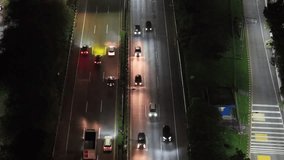 A stunning aerial night view of the city captured by drone, showcasing illuminated buildings and moving cars creating dynamic light trails along the busy roads - Powered by Shutterstock - Get 15% off with code: PIKWIZARD15