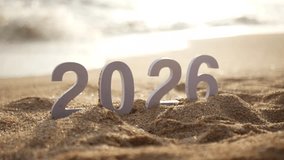 number 2026 for new year sign on summer beach at sunset, with ripple sea wave and beautiful nature at background, 2026 New Year celebration concept - Powered by Shutterstock - Get 15% off with code: PIKWIZARD15