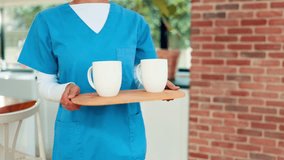 Senior couple, documents and caregiver with coffee for finance, budget planning and mortgage. Elderly people, paperwork and volunteer with beverage, medical insurance and financial expenses at house - Powered by Shutterstock - Get 15% off with code: PIKWIZARD15