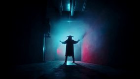 Silhouette of a horned demon figure conjuring in a dark corridor, performing a sinister ritual. Creepy Halloween atmosphere with supernatural evil spirit and frightening horror concept. - Powered by Shutterstock - Get 15% off with code: PIKWIZARD15