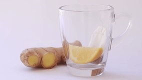 A warm cup of ginger root and lemon tea with fresh ingredients, showcasing steaming liquid, vibrant colors, and a cozy, healthy beverage perfect for wellness. - Powered by Shutterstock - Get 15% off with code: PIKWIZARD15