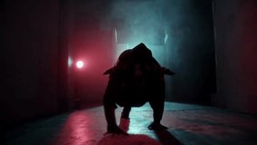 Silhouette of a horned demon crawling in a dark corridor, capturing Halloween horror, evil rituals, and supernatural dark fantasy concepts. - Powered by Shutterstock - Get 15% off with code: PIKWIZARD15