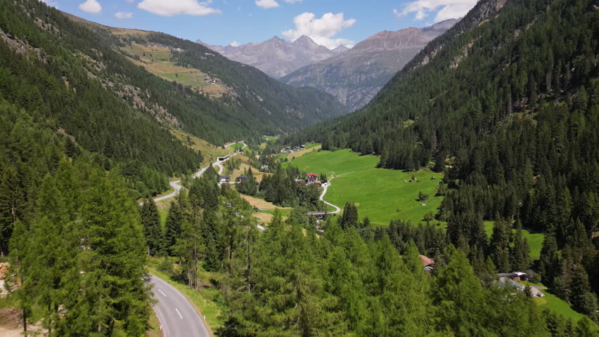 Aerial view of the Alps mountains in Bavaria Germany. Beautiful mountain road, nature landscapes, peaks, slopes and forests, travel in Europe.