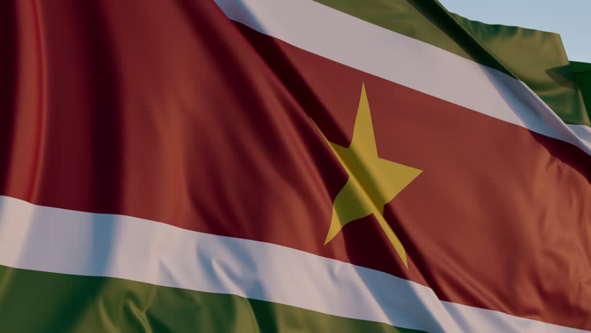 Suriname, Paramaribo: Cinematic Waving National Flag Against Blue Sky