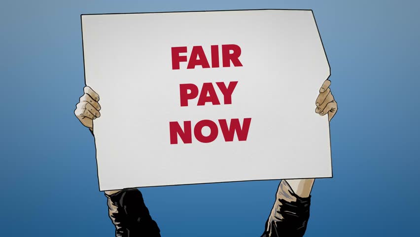 Fair Pay Now Protest Sign Held Up Against Blue Background Labor Message