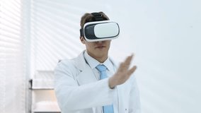 Modern technology. Doctor using virtual reality headset indoors - Powered by Shutterstock - Get 15% off with code: PIKWIZARD15