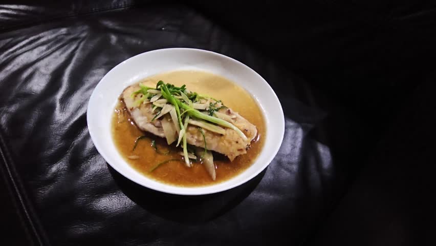 Tim Ikan,Steamed snapper fish with soybean sauce in a plate,Fish in soysauce