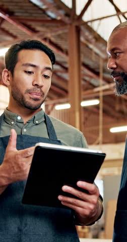 Carpentry, review or people in factory with tablet, team or material management in lumber industry. Collaboration, feedback or carpenter in warehouse with tech, stock or digital checklist in woodwork