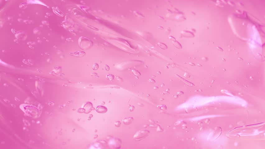 Cosmetics pink serum gel background, transparent cream texture, facial mask 