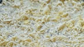 Shiny spoon stirs soupy noodles inside black dish with smooth steam effect - Powered by Shutterstock - Get 15% off with code: PIKWIZARD15