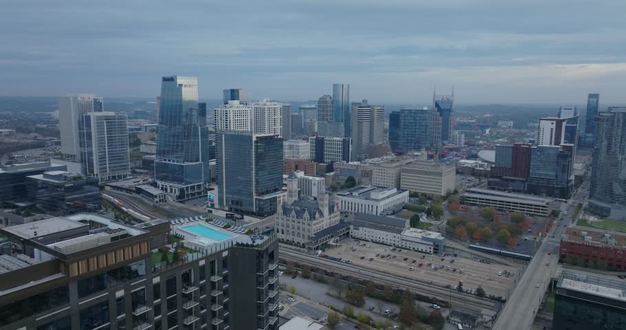 Skyline of Nashville, Tennessee, with cloudy mood and urban vibe
