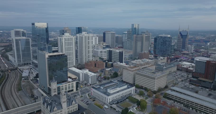 Nashville skyline view with tall buildings under a cloudy sky