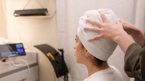 Spa therapist preparing the clients hair with a protective cap before a wellness treatment in a calm spa environment - Powered by Shutterstock - Get 15% off with code: PIKWIZARD15