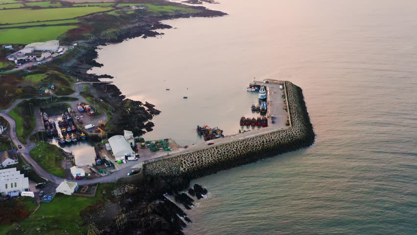 Aerial view of Port Oriel showing boats docked along the pier in calm evening light