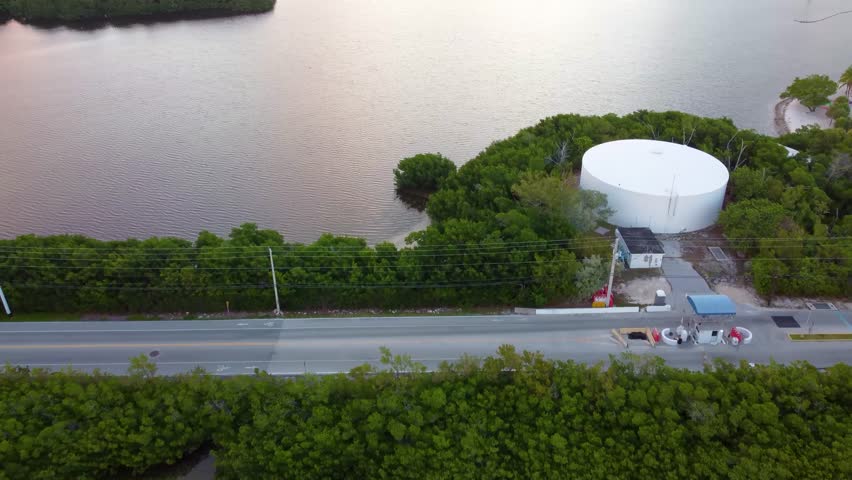Drone flies over Sigsbee Road toward Dredgers Key in Key West, showing scenic waterfront, tropical island landscapes, and coastal road views