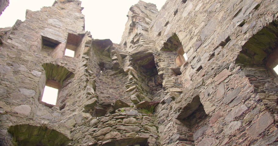 Mid Tilting down shot of the inside ruined Knock castle,