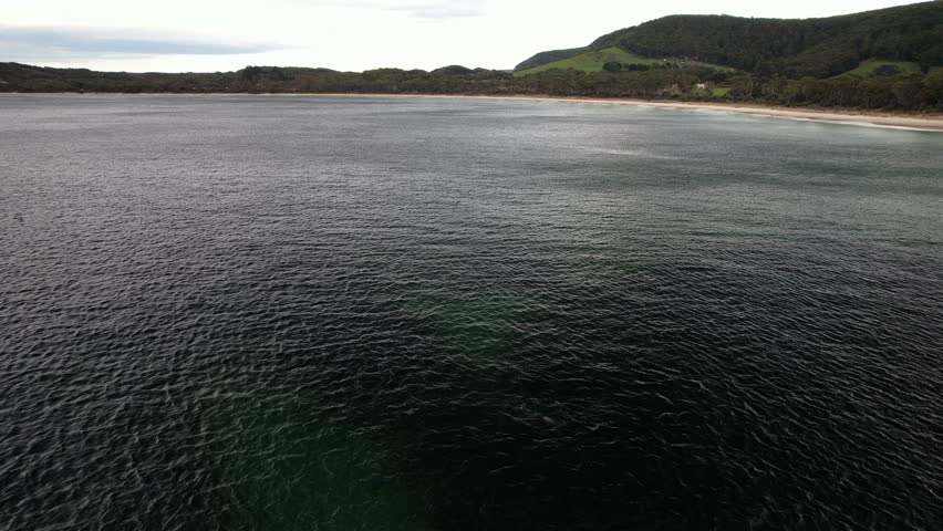 Safety Cove Beach With Tranquil Waters In Port Arthur, Tasmania, Australia - Drone Pullback